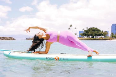 Morning paddle board yoga class in Waikiki